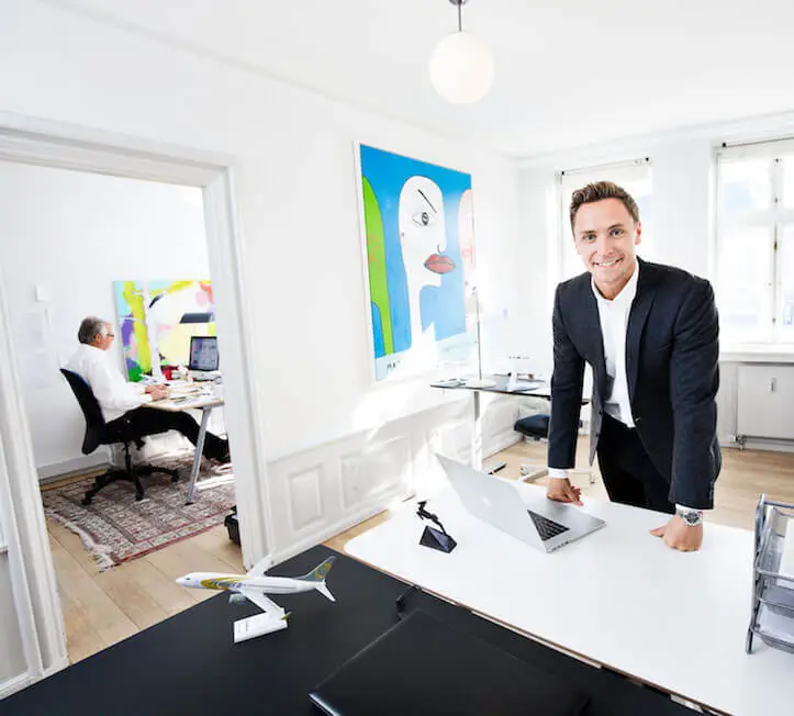 Daniel Wilk, CEO of Officeguru, standing at his desk